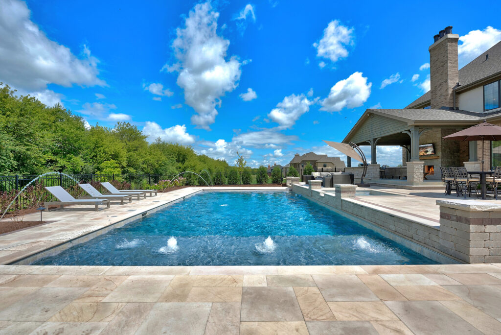 big swimming pool with lounge chairs